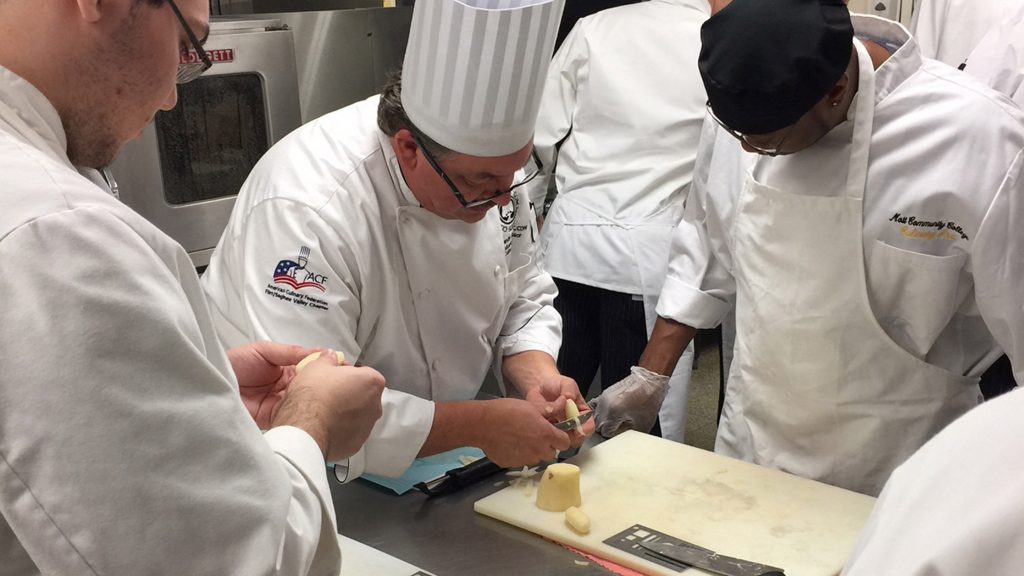 Students learn culinary techniques at Mott Community College Culinary Institute